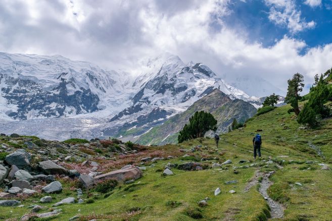 A scenic view of people hiking to Rakaposhi glacier in Minapin, Karakoram highway, Pakistan
